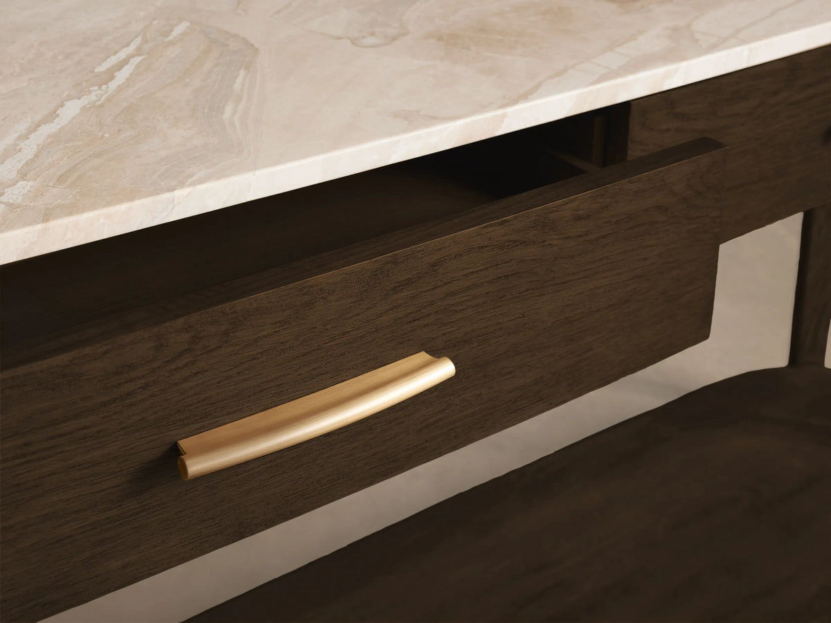 Front view of a dark wood console table with a white marble top, two drawers with gold pulls, one partially open, and a lower shelf.