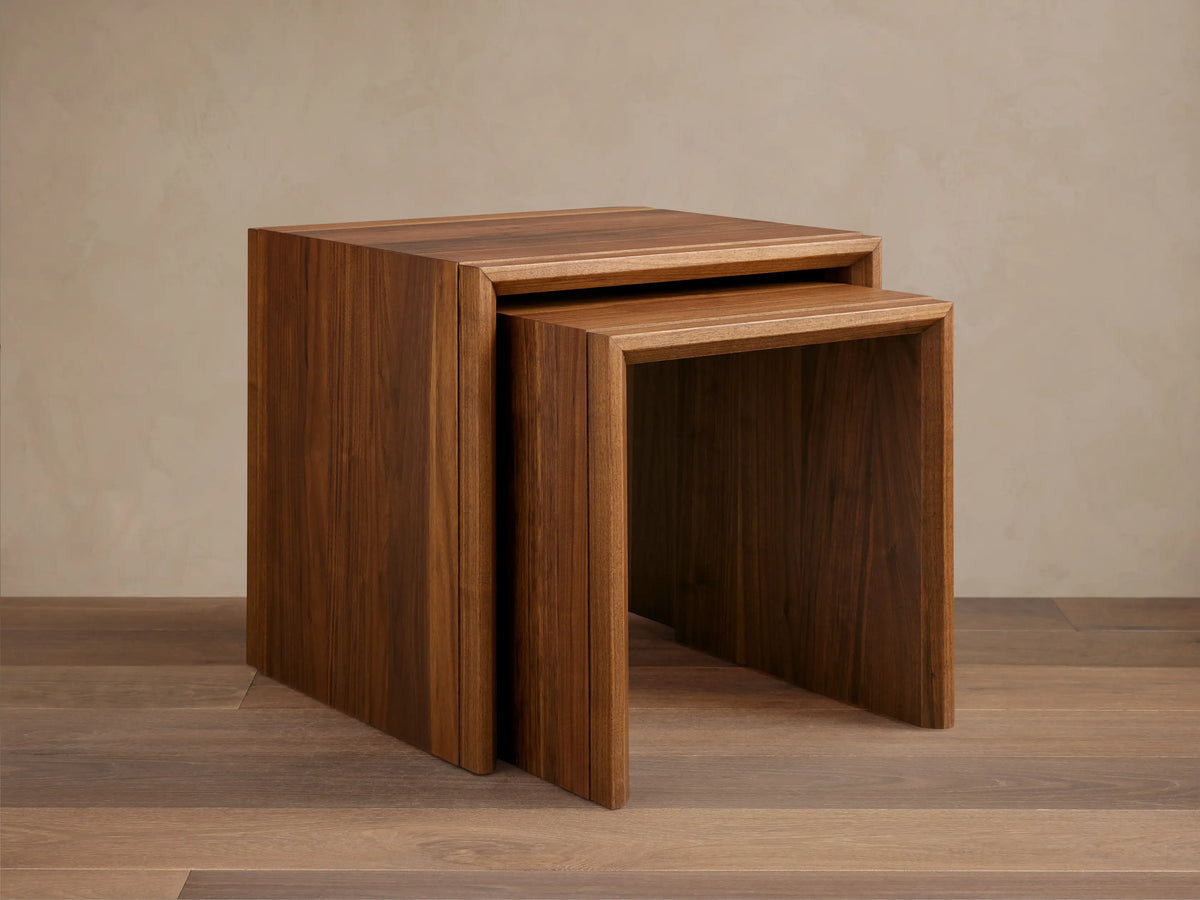 Close-up of the Elien Nesting End Table corner, showing wood grain texture and smooth edges in a warm brown finish.
