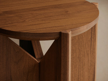 Elien End Table with round top and knife-edge detailing, crafted from walnut veneers. Wooden base with triangular support design.