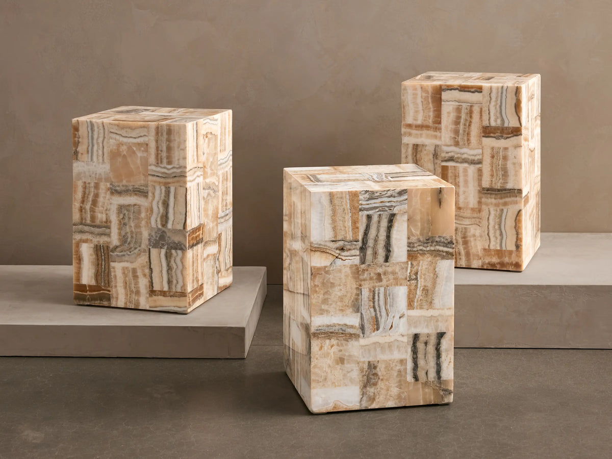 Three rectangular Eula Onyx Stools with a tiled pattern of ivory, beige, dark brown, and black onyx.