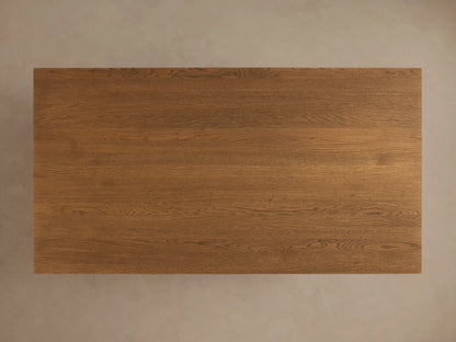 Close-up of the Eaves Coffee Table, showing its warm brown oak wood, modern double-frame design, and natural grain.