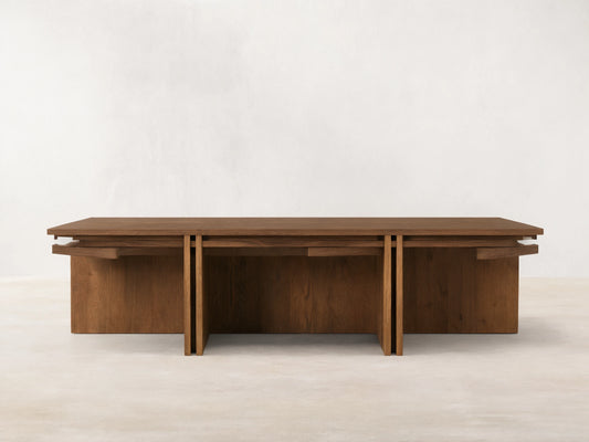 Eaves Coffee Table: Modern rectangular solid oak wood with double-frame design, warm brown finish, on a wood floor.