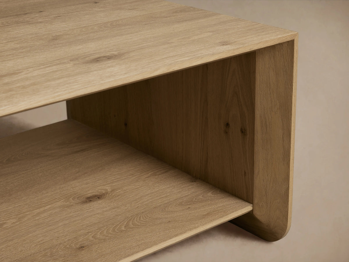 Felton Coffee Table made of solid oak with oak veneers, rectangular shape, open shelf design, natural wood finish, against a neutral background.