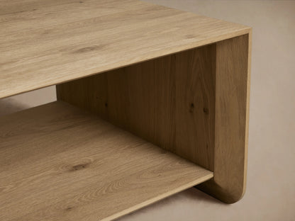 Felton Coffee Table made of solid oak with oak veneers, rectangular shape, open shelf design, natural wood finish, against a neutral background.