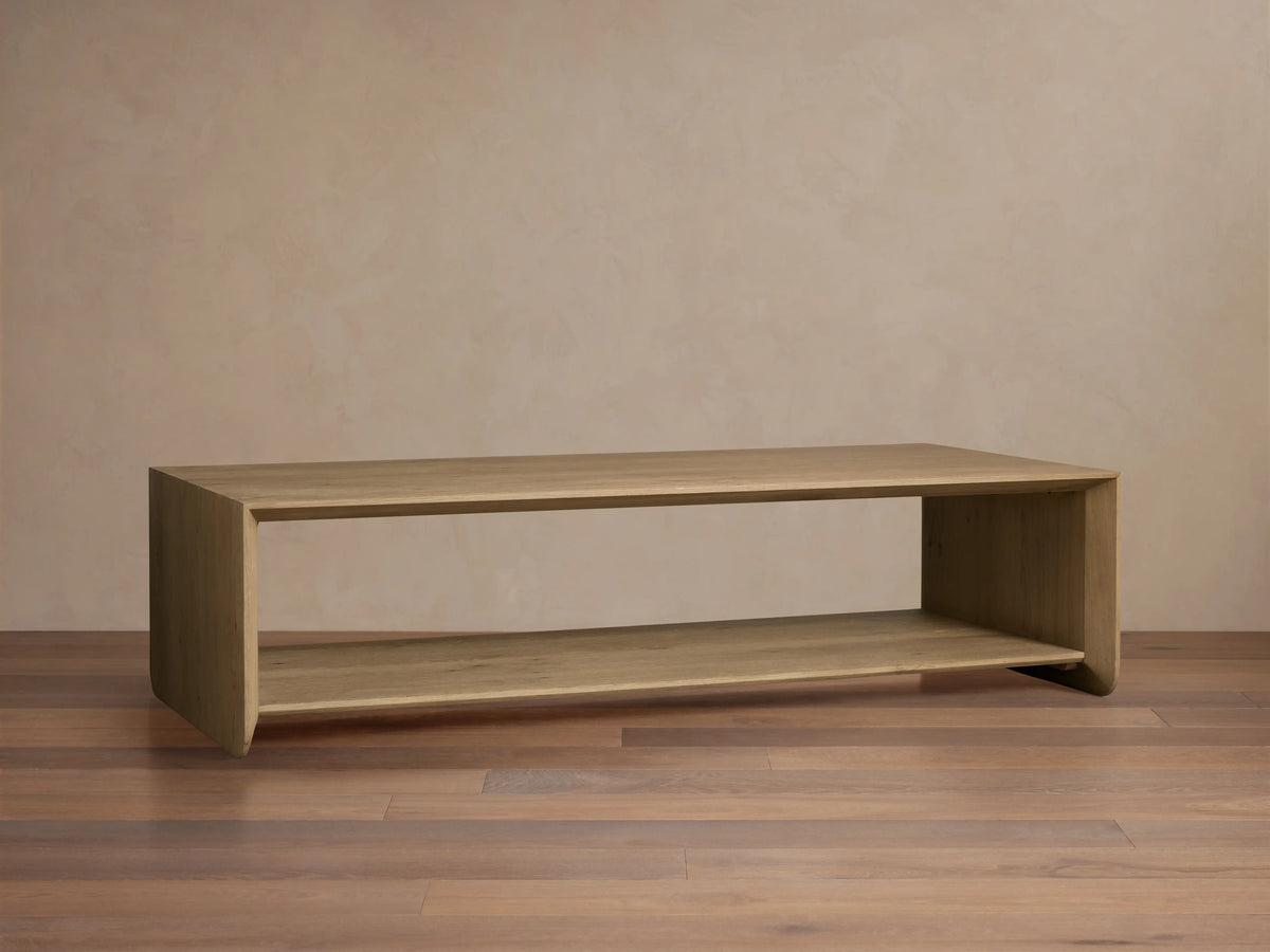 Felton Coffee Table crafted from solid oak, showing two-tier design with smooth, rounded edges and natural wood grain pattern.