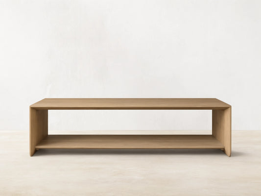 Felton Coffee Table made of solid oak with oak veneers, rectangular shape, open shelf design, natural wood finish, against a neutral background.
