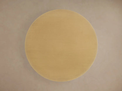 Ferdinand Leather Martini Table with brass-finished round tabletop and leather-wrapped stem featuring ivory stitching.