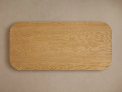 Finnley Wood Coffee Table featuring a honey finish with vertical slats, constructed from white oak with a rounded edge design.