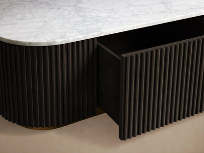 Finnley Storage Coffee Table with a sleek, rectangular design. Features a dark ribbed body, a light top surface, and a brass-finished base.