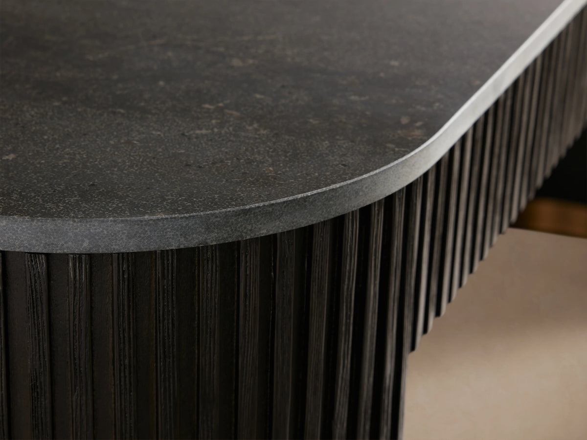 Finnley Console Table with Liath Smoke finish, featuring fluted texture, curved edges, and brass-finished zinc-alloy base accents.