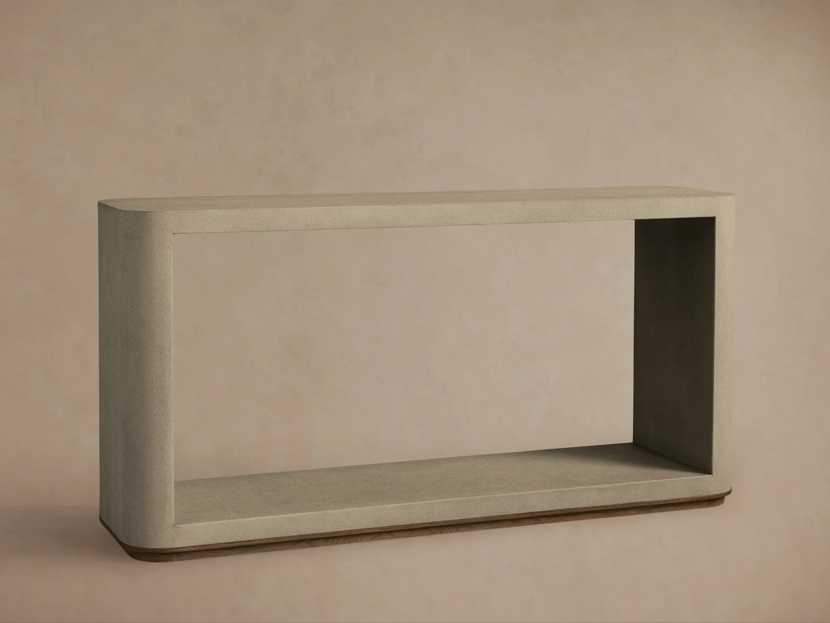 Close-up of Harrow Console Table, light tan, featuring a detailed, pebbled shagreen-embossed texture on its curved top surface.