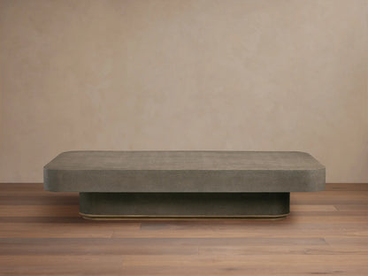 Harrow Coffee Table with a rectangular shape, oak hardwood and faux shagreen embossed surface in a neutral color, on wooden floor.
