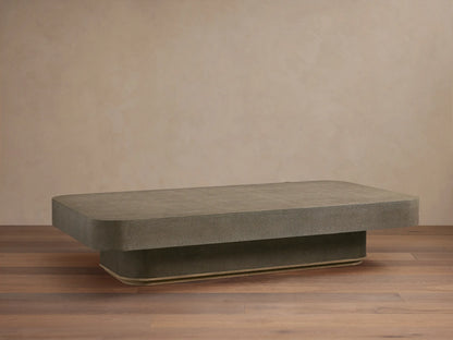 Harrow Coffee Table with a rectangular shape, oak hardwood and faux shagreen embossed surface in a neutral color, on wooden floor.