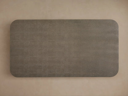 Harrow Coffee Table with a rectangular shape and rounded edges, shown in a dark gray shagreen-textured finish over oak wood base.