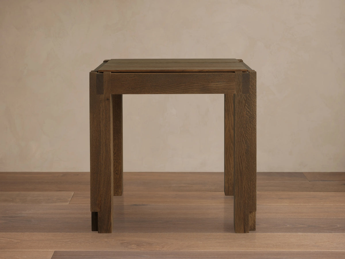 Harlan End Table viewed from above, showcasing its square solid oak wood top with visible grain and corner block details.