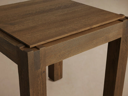 Harlan End Table made of solid oak with a square top and sturdy legs. Features natural wood grain and lacquer sheen.