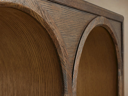 Hattie Console Table crafted from dark oak wood, features three arch designs with contrasting light interior finish.