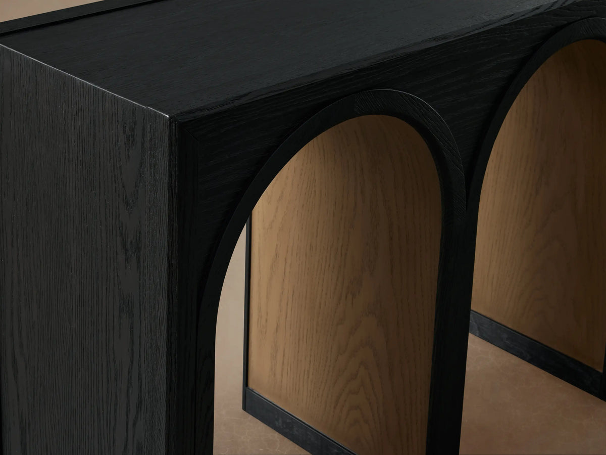 Hattie Console Table featuring solid black oak wood with three arched openings and contrasting natural wood finish inside.