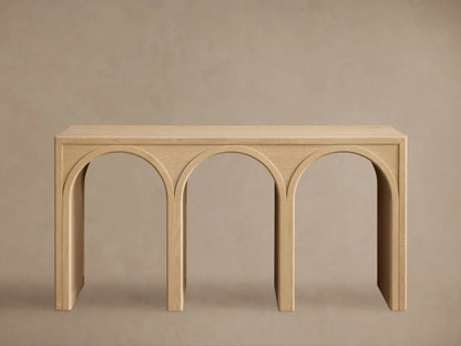 Hattie Console Table made of solid oak with a natural finish, featuring two arch-shaped cutouts with contrasting interiors.