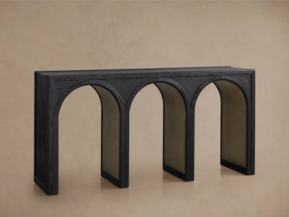 Hattie Console Table with solid oak construction, dark finish, and three arched legs with contrasting interiors, on a beige background.