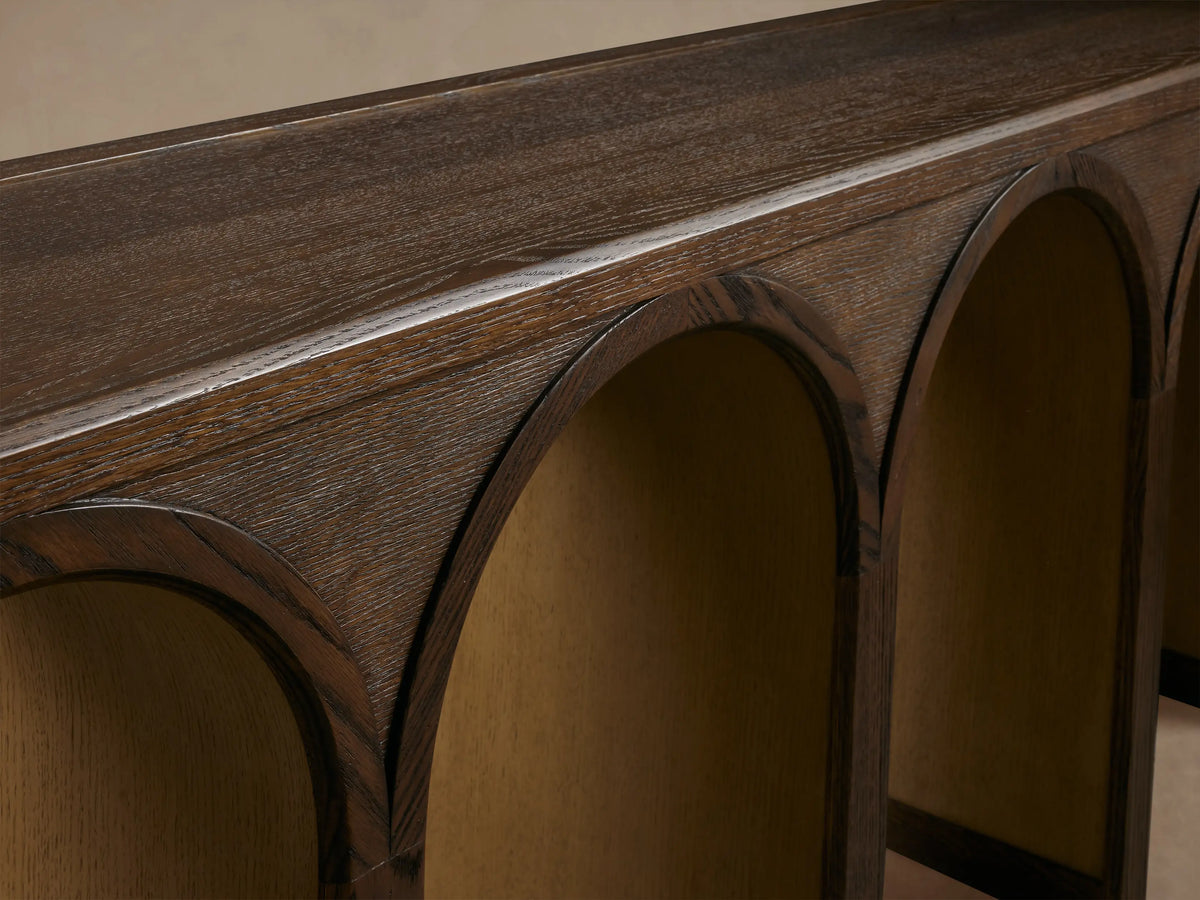 Hattie Console Table made of solid oak with five arch-shaped legs, showcasing dark wood with contrasting finish in arches.