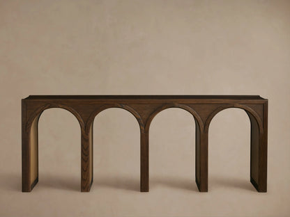 Hattie Console Table made of dark solid oak wood with arch interiors in a contrasting lighter finish, showcasing craftsmanship.