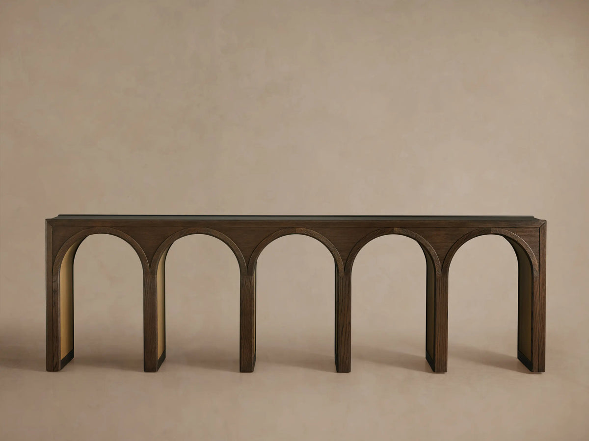 Hattie Console Table with arched design in solid oak wood, contrasting interior finish, set against a neutral wall.