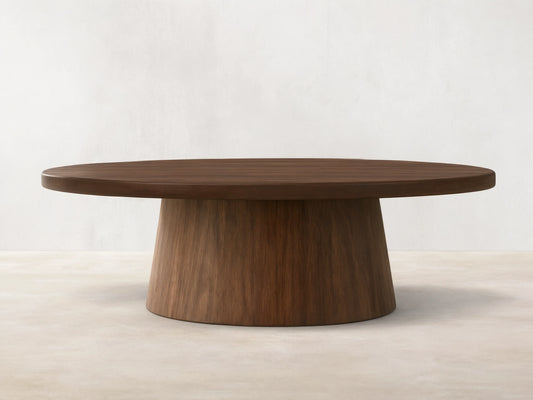 Hemmings Nesting Coffee Table. Round, dark walnut veneer tabletop on a sturdy, tapering cylindrical base. Rich wood grain.