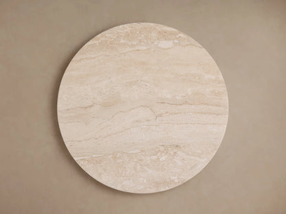 Close-up of Hemmings Stone Nesting Coffee Table, showcasing the beige coralle marble tabletop with natural swirling patterns and a subtle sheen.