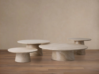 Round beige coralle marble tabletop with natural swirling patterns and veining, viewed from above, set against a neutral background.