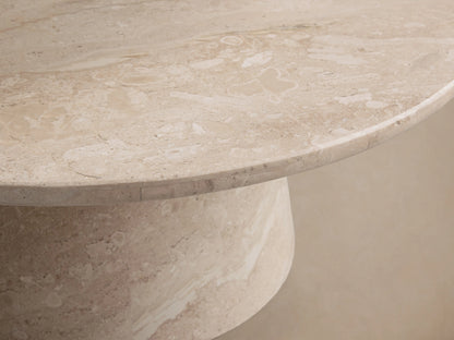Hemmings Stone Nesting Coffee Table with a beige coralle marble top and conical base, showcasing natural patterns and sheen.
