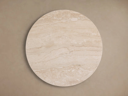 Hemmings Stone Nesting Coffee Table features a smooth beige coralle marble top with natural variations, showcasing its circular shape.