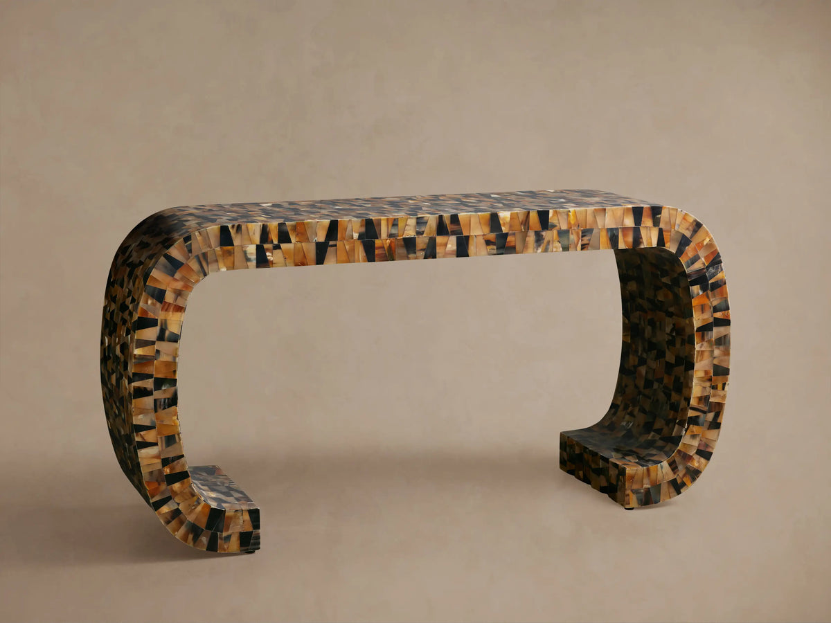 Lindly Console Table, close-up of rounded top & side covered in mosaic natural buffalo horn in amber, black, brown hues.