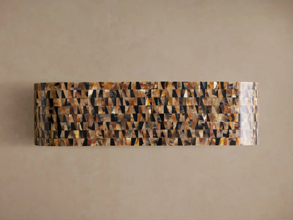 Lindly Console Table, a rounded, C-shaped table with a mosaic pattern of natural amber, brown, and black buffalo horn pieces.