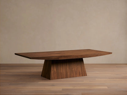 Ilaria Coffee Table with a rectangular walnut veneered top and sculptural pedestal base, styled with flowers, in a living room.