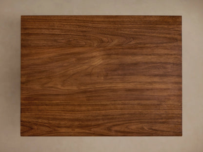 Ilaria End Table made of rich brown wood with a smooth, square tabletop and a tapered base. Smooth finish with visible grain pattern.
