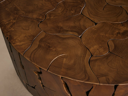 Kalmar Round Coffee Table made of teak wood with distinct organic shapes, featuring visible cracks and natural knots.