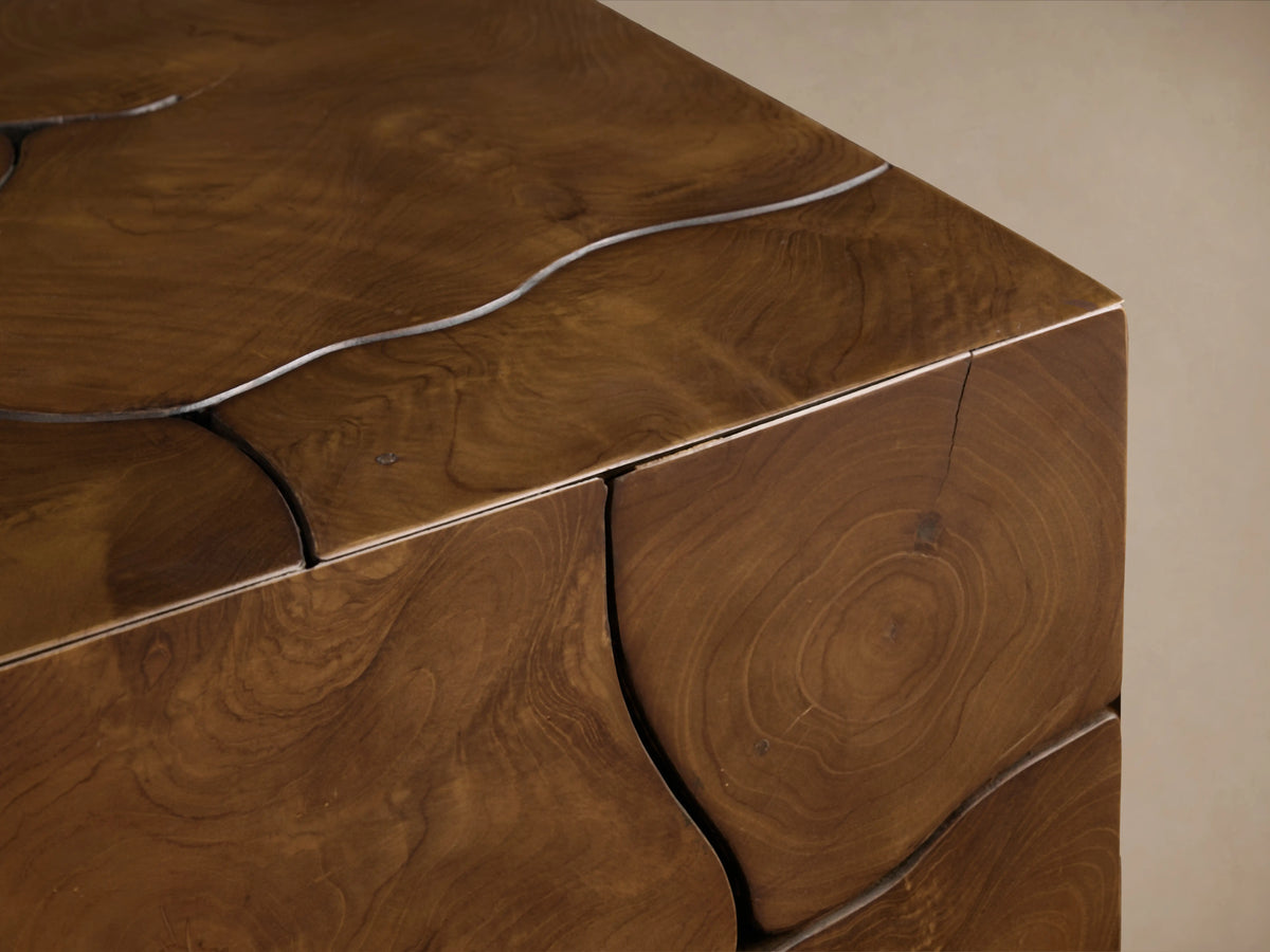 Kalmar End Table with visible natural teak wood grain, organic shapes, cracks, and a distinct floating construction on the corner.