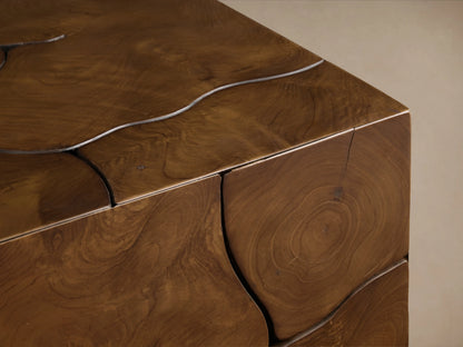 Kalmar End Table with visible natural teak wood grain, organic shapes, cracks, and a distinct floating construction on the corner.