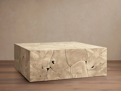 Kalmar Square Coffee Table made of natural teak wood, featuring organic shapes, cracks, and textures on a wood floor.