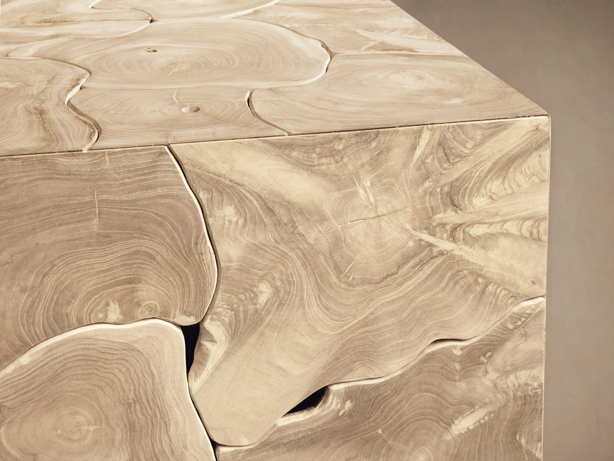 Kalmar Square Coffee Table corner close-up showing natural teak wood grain, organic shapes, and visible cracks with a smooth finish.