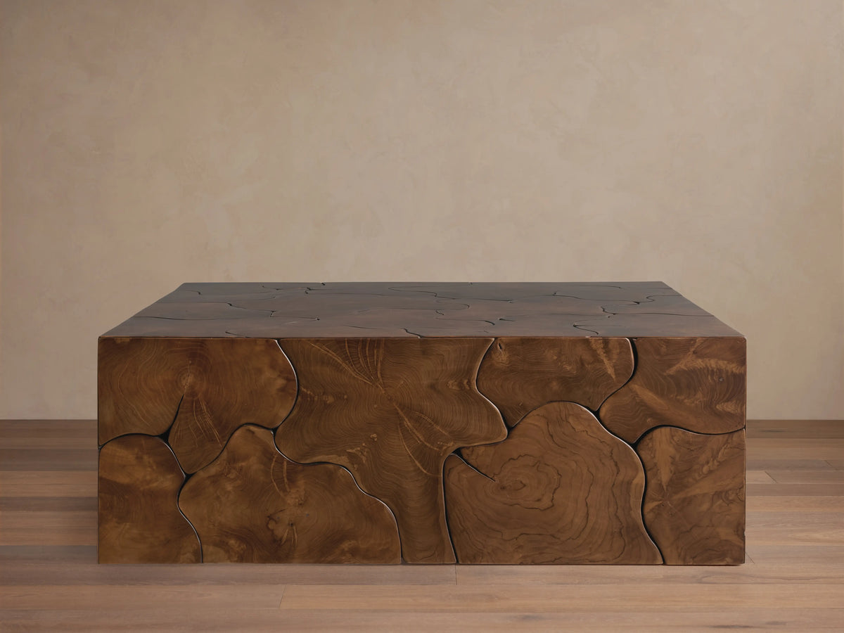 Kalmar Square Coffee Table made of natural teak wood, featuring unique organic shapes and visible knots on its surface.