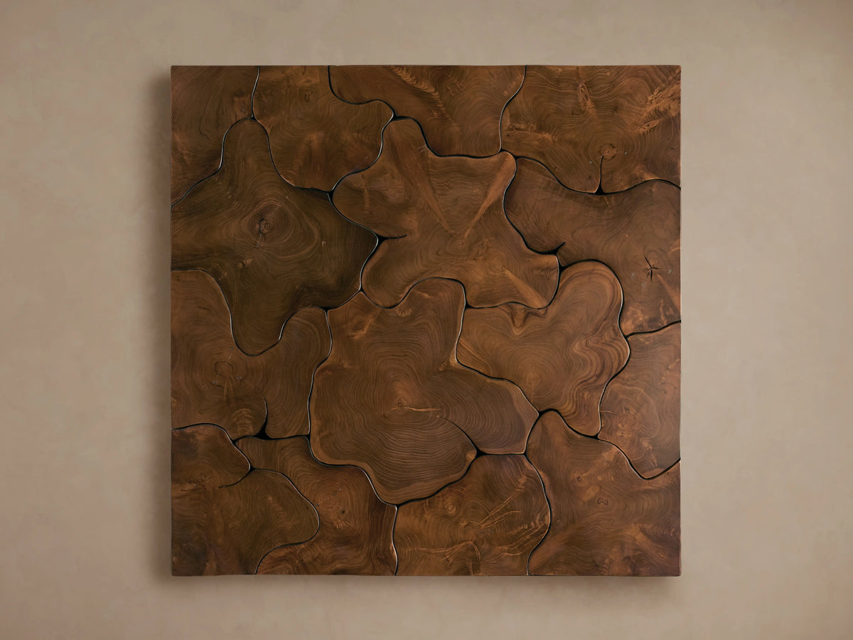 Square coffee table made from natural teak, showing organic shapes and cracks with a rich brown patina.
