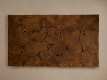Kalmar Coffee Table in dark teak wood with natural cracks and organic patterns, sits on a light wooden floor against a beige wall.