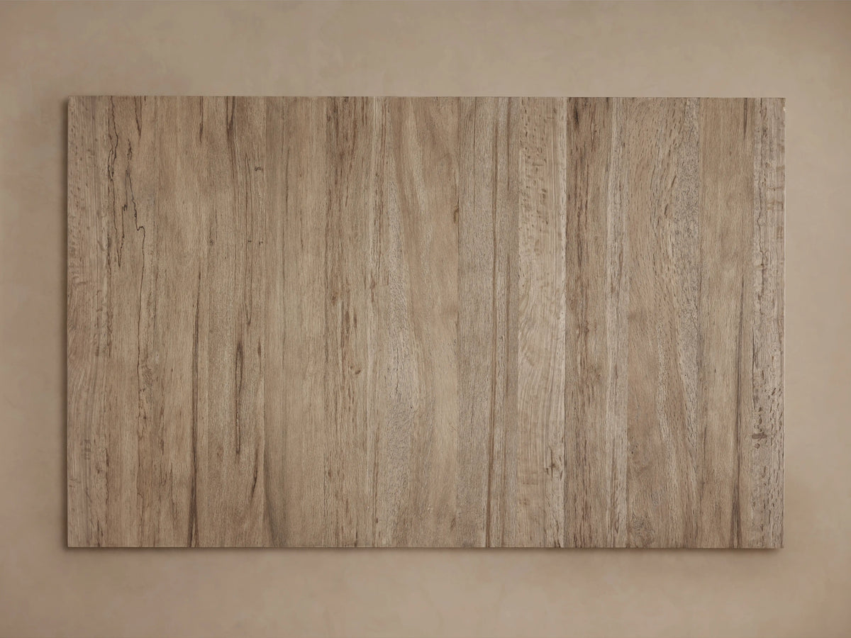 Leandro Coffee Table with a rectangular surface, showcasing vertical wooden grain patterns in light brown, highlighted by natural imperfections.
