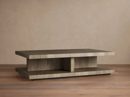 Leandro Coffee Table made of reclaimed wood, with a thick rectangular top, subtle grain, and smooth finish on wooden flooring backdrop.