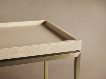 Malone End Table: Square, light beige shagreen-patterned tray top on a gold metal base with an X-stretcher. Angled view.