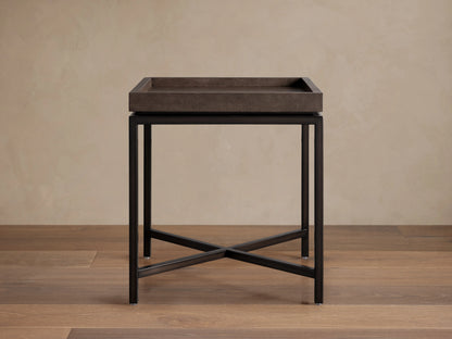 Malone End Table with a square top featuring embossed shagreen pattern in dark brown. Steel base with cross design, finished in black.