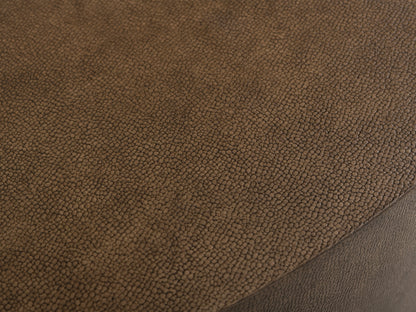 Close-up of the Malone Round Plinth Coffee Table tabletop, showcasing the brown shagreen-patterned reconstituted leather surface.