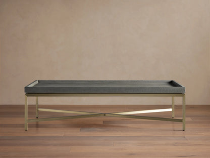 Malone Coffee Table with engineered hardwood top in shagreen pattern, reconstituted leather, and steel base, light brown floor.
